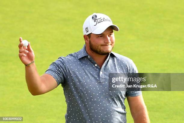 Zander Lombard of South Africa reacts after an eagle on the 18th hole during round three of the Open Championship at Carnoustie Golf Club on July 21,...