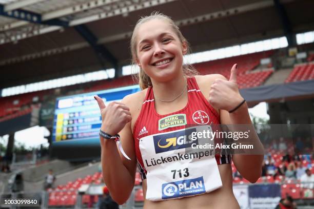 Gina Lueckenkemper of TSV Bayer 04 Leverkusen poses after winning the women's 100 metres final during day 2 of the German Athletics Championships at...