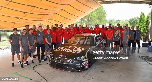 Liverpool players and staff pose for a group photograph at the end of the tour of Roush Fenway Racing on July 21, 2018 in Charlotte, North Carolina.