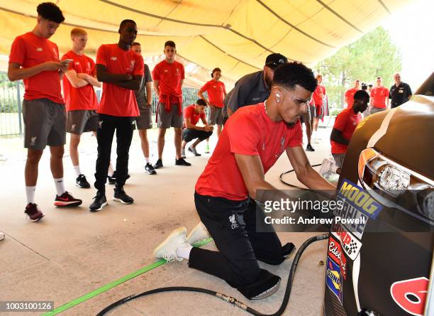 Dominic Solanke of Liverpool changing tyres during a tour of Roush Fenway Racing on July 21, 2018 in Charlotte, North Carolina.