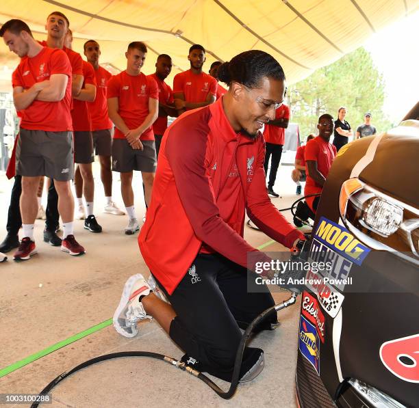 Virgil van Dijk of Liverpool changing tyres during a tour of Roush Fenway Racing on July 21, 2018 in Charlotte, North Carolina.