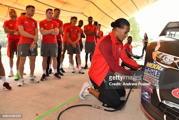 Virgil van Dijk of Liverpool changing tyres during a tour of Roush Fenway Racing on July 21, 2018 in Charlotte, North Carolina.