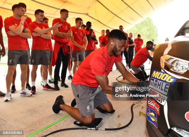 Joe Gomez of Liverpool changing tyres during a tour of Roush Fenway Racing on July 21, 2018 in Charlotte, North Carolina.