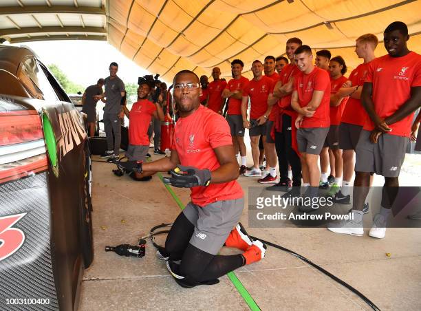 Daniel Sturridge of Liverpool changing tyres during a tour of Roush Fenway Racing on July 21, 2018 in Charlotte, North Carolina.