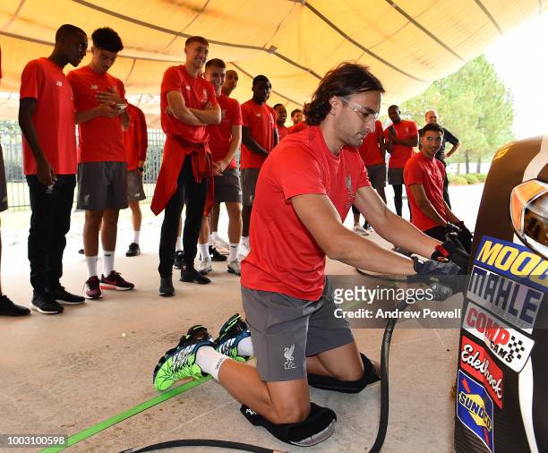 Lazar Markovic of Liverpool changing tyres during a tour of Roush Fenway Racing on July 21, 2018 in Charlotte, North Carolina.
