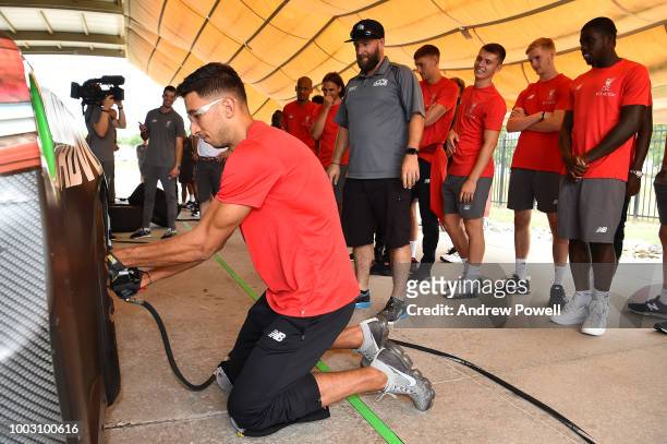 Marko Grujic of Liverpool changing tyres during a tour of Roush Fenway Racing on July 21, 2018 in Charlotte, North Carolina.