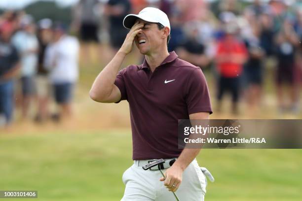 Rory McIlroy of Northern Ireland reacts to missing eagle putt on the 14th hole green during round three of the Open Championship at Carnoustie Golf...