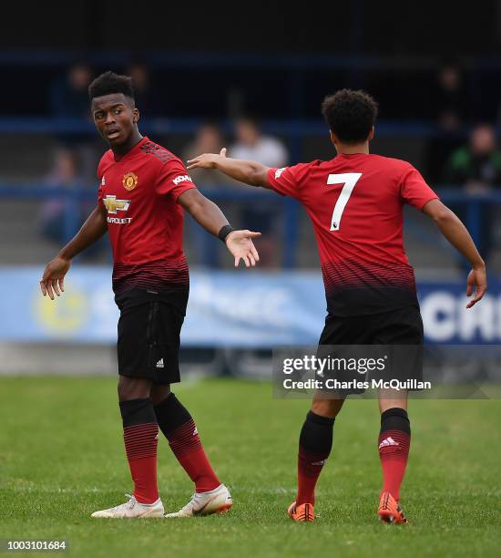 Ethan Laird of Manchester United celebrates with team mates after scoring during the u19 NI Super Cup gala match at Coleraine Showgrounds on July 21,...