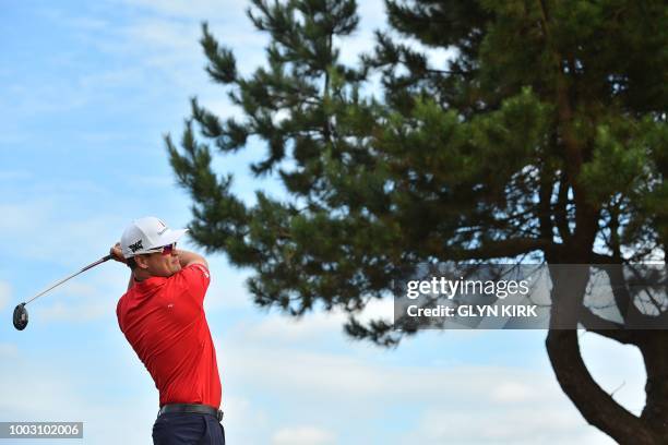 Golfer Zach Johnson watches his shot from the 11th tee during his third round on day 3 of The 147th Open golf Championship at Carnoustie, Scotland on...