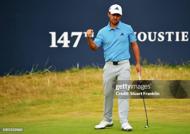 Xander Schauffele of the United States celebrates a birdie on the 18th hole during the third round of the 147th Open Championship at Carnoustie Golf...