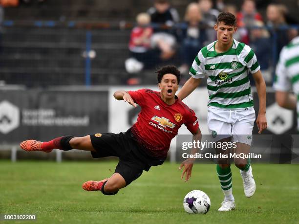 Nishan Burkart of Manchester United and Wallace Duffy of Celtic during the u19 NI Super Cup gala match at Coleraine Showgrounds on July 21, 2018 in...