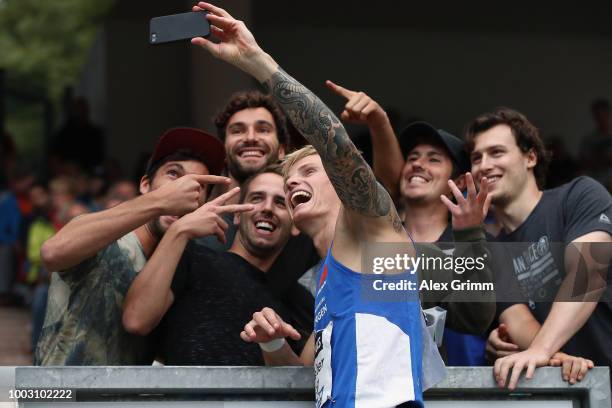 Gregor Traber takes a selfie with friends after winning the men's 110 metres hurdles final during day 2 of the German Athletics Championships at...