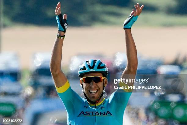 Spain's Omar Fraile celebrates a she crosses the finish line to win the 14th stage of the 105th edition of the Tour de France cycling race, between...