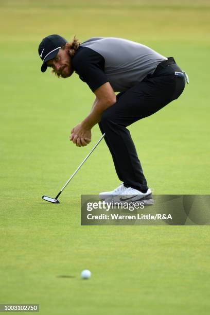 Tommy Fleetwood of England reacts to his missed birdie putt on the 18th hole green during round three of the Open Championship at Carnoustie Golf...