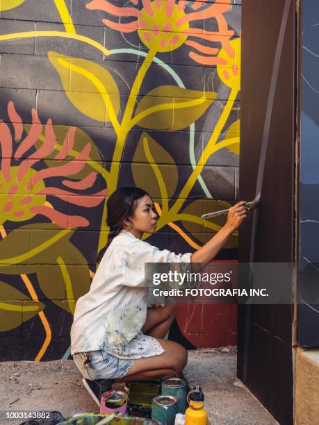 mural artist at work - artsy stock pictures, royalty-free photos & images