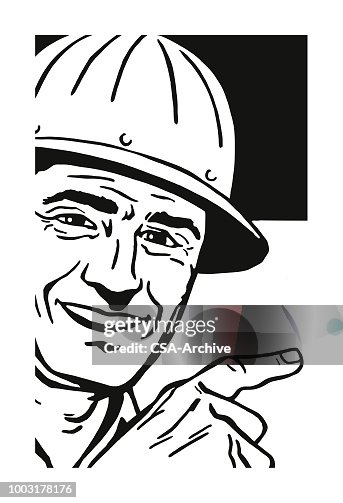 Smiling Man Wearing a Hard Hat Smiling Man Wearing a Hard Hat