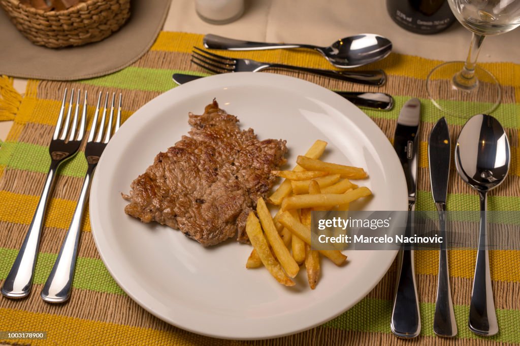 Grilled steak with French fries