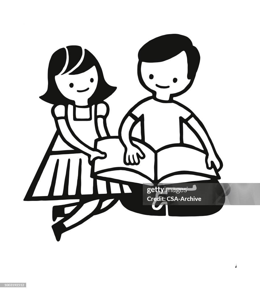 Duas crianças lendo um livro