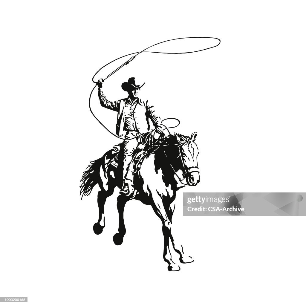 Cowboy con un lazo a cavallo