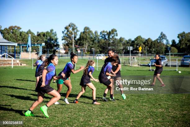 under 13 girls playing rugby in queensland australia - rugby training stock pictures, royalty-free photos & images