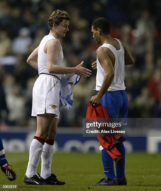 Ole Gunnar Solskjaer of United swaps shirts with Naybet of Deportivo after the UEFA Champions League Quarter Final Second Leg match between...