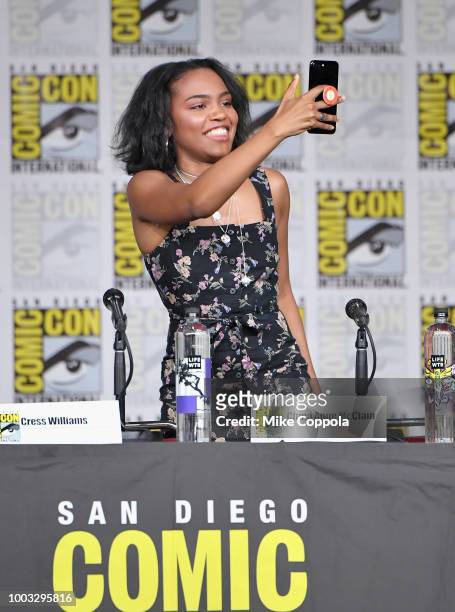 China Anne McClain takes a photo onstage at the "Black Lightning" Special Video Presentation and Q&A during Comic-Con International 2018 at San Diego...