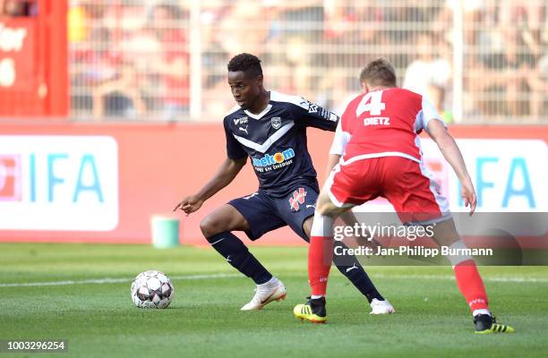 Francois Kamano of FC Girondins Bordeaux and Lars Dietz of 1 FC Union Berlin during the test match between Union Berlin and FC Girondins Bordeaux at...