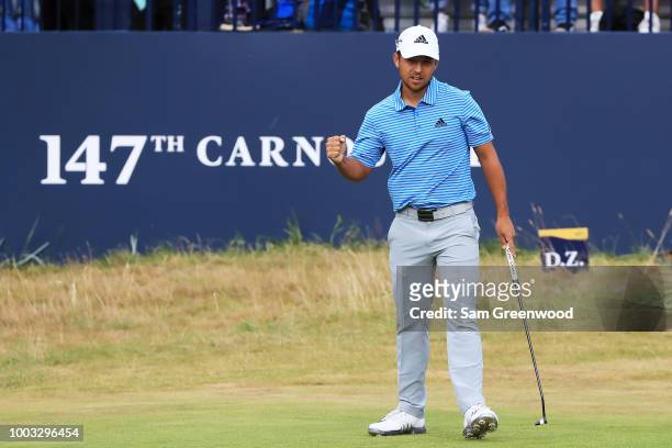 Xander Schauffele of the United States celebrates a birdie on the 18th hole during the third round of the 147th Open Championship at Carnoustie Golf...