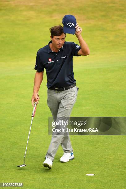 Kevin Kisner of the United States acknowledges the crowd on the 18th hole green following round three of the Open Championship at Carnoustie Golf...