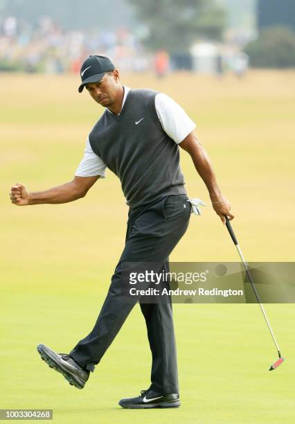 Tiger Woods of the United States reacts to a birdie on the ninth green during the third round of the 147th Open Championship at Carnoustie Golf Club...