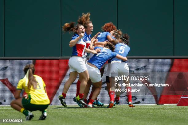 Players of team France celebrate after winning their semi final against Australia during day two of the Rugby World Cup Sevens at AT&T Park on July...