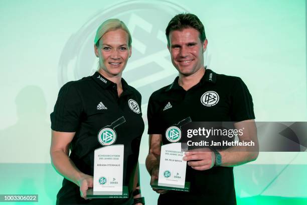 Referees Bibiana Steinhaus and Felix Brychpose with their award trophies after being awarded as referee of the year 2018 on July 21, 2018 in Grassau,...