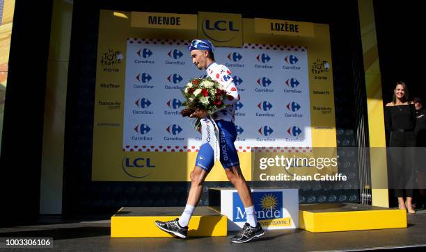 Julian Alaphilippe of France and Quick Step Floors retains the dot jersey of best climber on the podium following stage 14th of Le Tour de France...