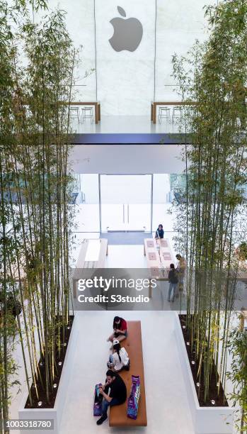 Visitors and buyers at the Apple Inc. Store in Macau, China, on July 18, 2018. As per Apple's financial results for its fiscal 2018 second quarter...