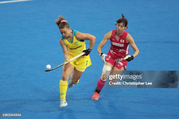 Ambrosia Malone of Australia control the ball while under pressure from Natsuki Naito of Japan during the Pool D game between Australia and Japan of...