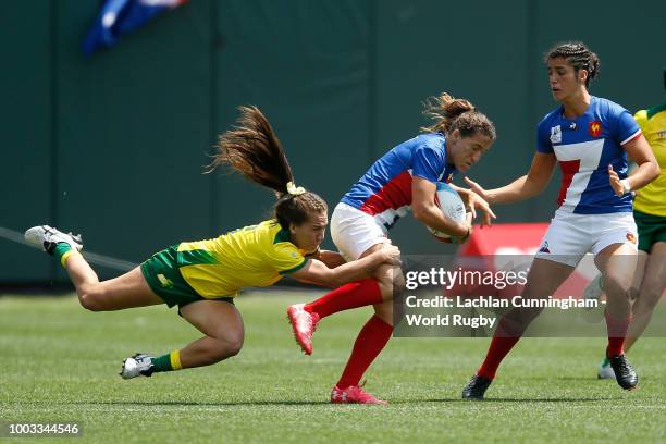 Fanny Horta of France is tackled by Evania Polite of Australia during their semi final match on day two of the Rugby World Cup Sevens at AT&T Park on...