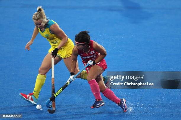 Akiko Kato of Japan battles with Stephanie Kershaw of Australia during the Pool D game between Australia and Japan of the FIH Womens Hockey World Cup...