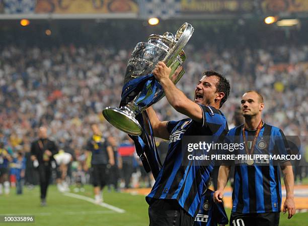 Inter Milan's Serbian midfielder Dejan Stankovic celebrates with the trophy after winning the UEFA Champions League final football match Inter Milan...