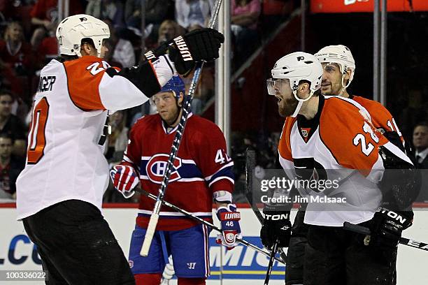 Ville Leino of the Philadelphia Flyers celebrates with teammate Chris Pronger after scoring a goal in the second period against the Montreal...