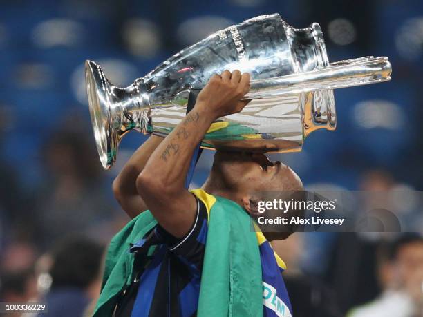 Maicon of Inter Milan celebrates with the UEFA Champions League trophy following his team's victory at the end of the UEFA Champions League Final...