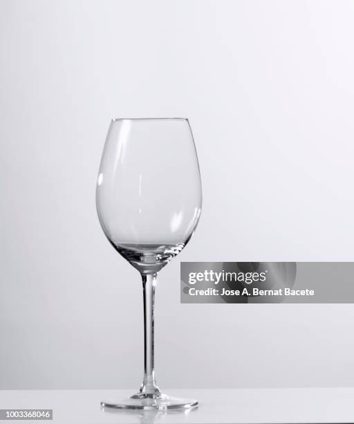empty wineglass of wine or of water of white background. - cleaning up after party stock pictures, royalty-free photos & images