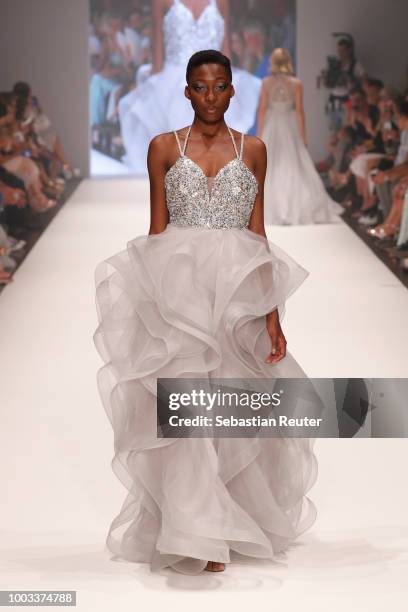 Toni Dreher-Adenuga walks the runway at the Unique by Lexus show during Platform Fashion July 2018 at Areal Boehler on July 21, 2018 in Duesseldorf,...