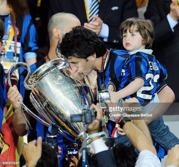 Diego Milito of Inter Milan kisses the UEFA Champions League trophy at the end of the UEFA Champions League Final match between FC Bayern Munich and...