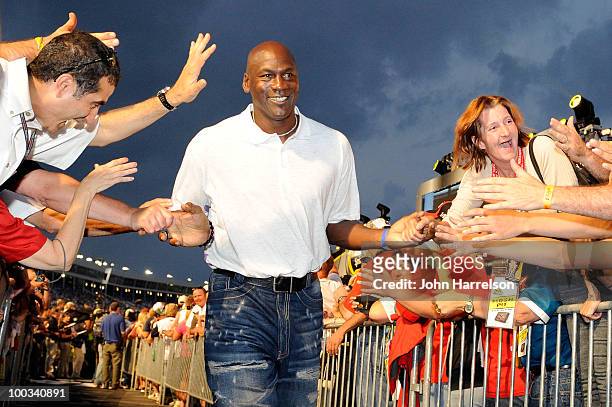 Former NBA Chicago Bulls gaurd Michael Jordon high-fives the crowd during pre-race ceremonies prior to the start of the NASCAR Sprint All-Star Race...
