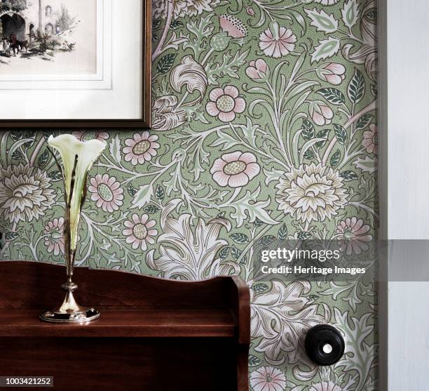 Room refurbished in Arts and Crafts style, Mount Grace Priory, East Harlsey, North Yorkshire, circa 1980-circa 2017. A vase and sideboard sit in...