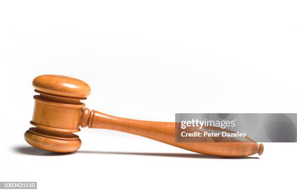 brown gavel on white background - hammer stock-fotos und bilder