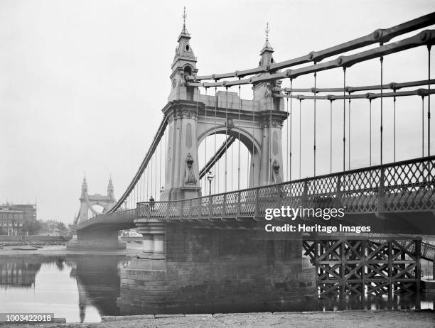 Hammersmith Bridge, Barnes, London, 1895. This decorative suspension bridge is seen here from the riverbank. It was built in 1887, designed by Sir...