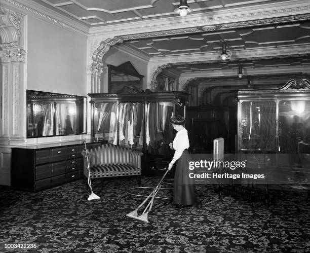 Vacuum cleaner demonstration, Frederick Gorringe's Department Store, 75 Buckingham Palace Road, London, 1910. A woman demonstrating the latest in...