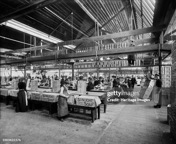 Lever Brothers Sunlight Soap Works, Port Sunlight, Wirral, Merseyside, 1897. Interior view showing workers packing soap boxes. Artist Henry Bedford...