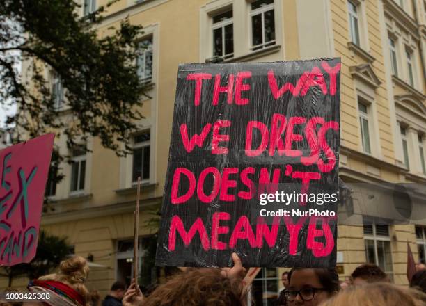 Protestor holds sign saying 'The way we dress doesn't mean yes'. Some 500 people demonstrated through the streets of Munich, Germany, on 21 July 2018...